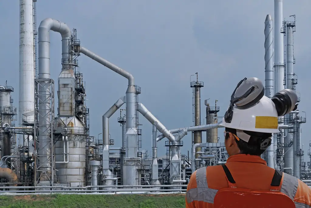 Engineers in a facility reviewing technical documentation